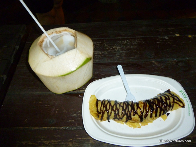 Dessert!  Banana pancake with chocolate syrup and a young coconut.  Delish!